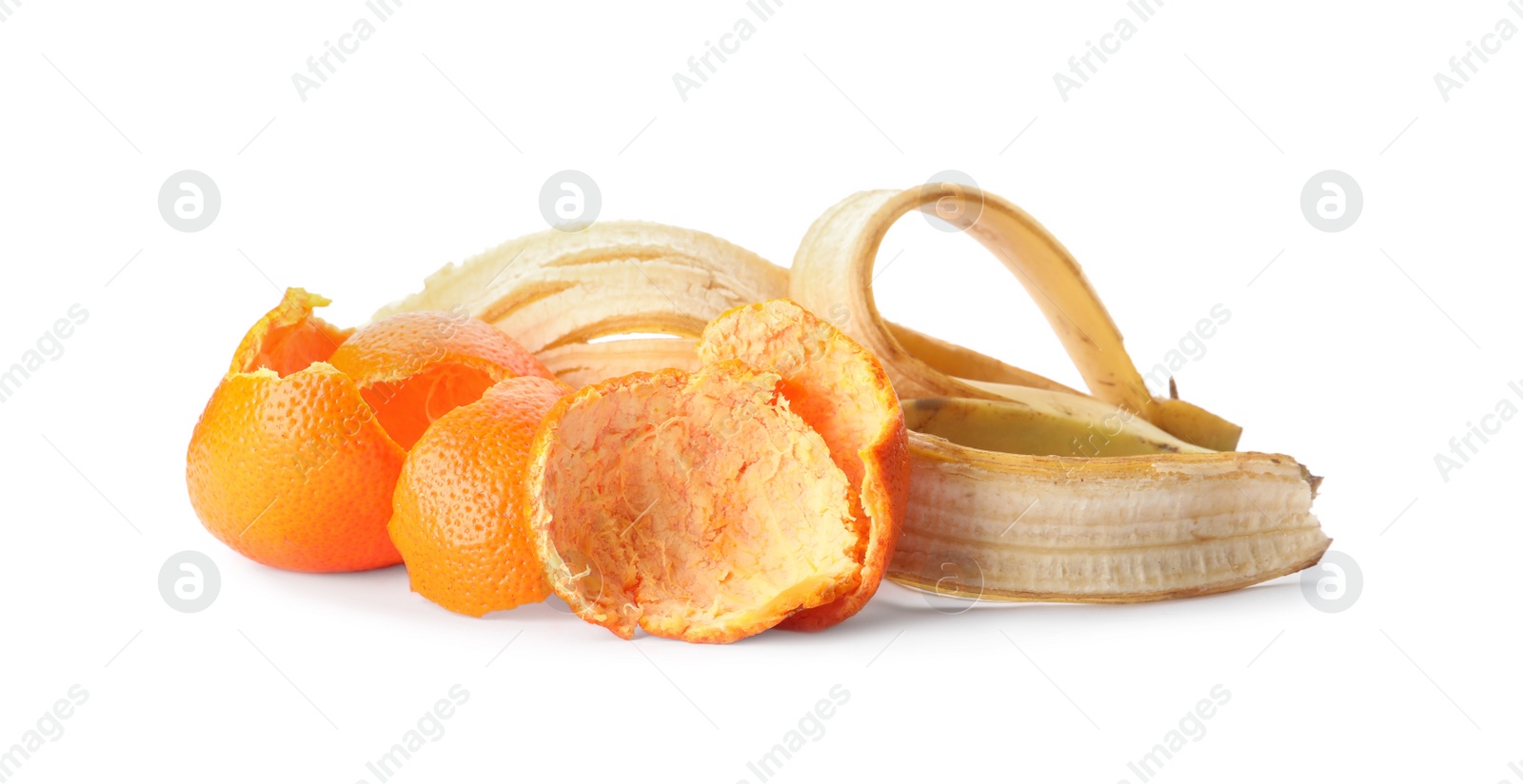 Photo of Banana and tangerine peel on white background. Composting of organic waste