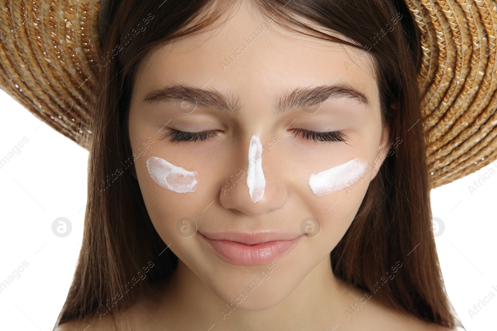 Photo of Teenage girl with sun protection cream on her face against white background, closeup