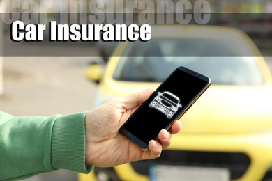 Image of Man using phone for car insurance outdoors, closeup