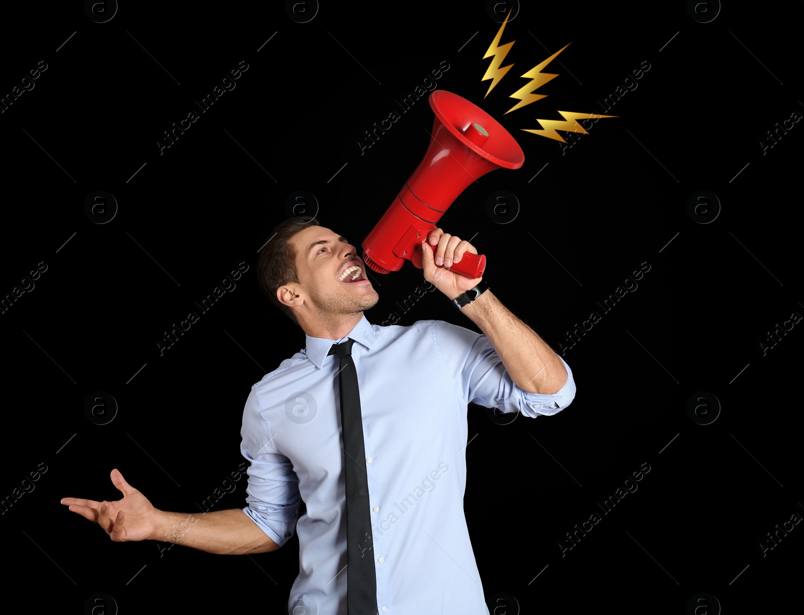 Image of Handsome man with megaphone on black background