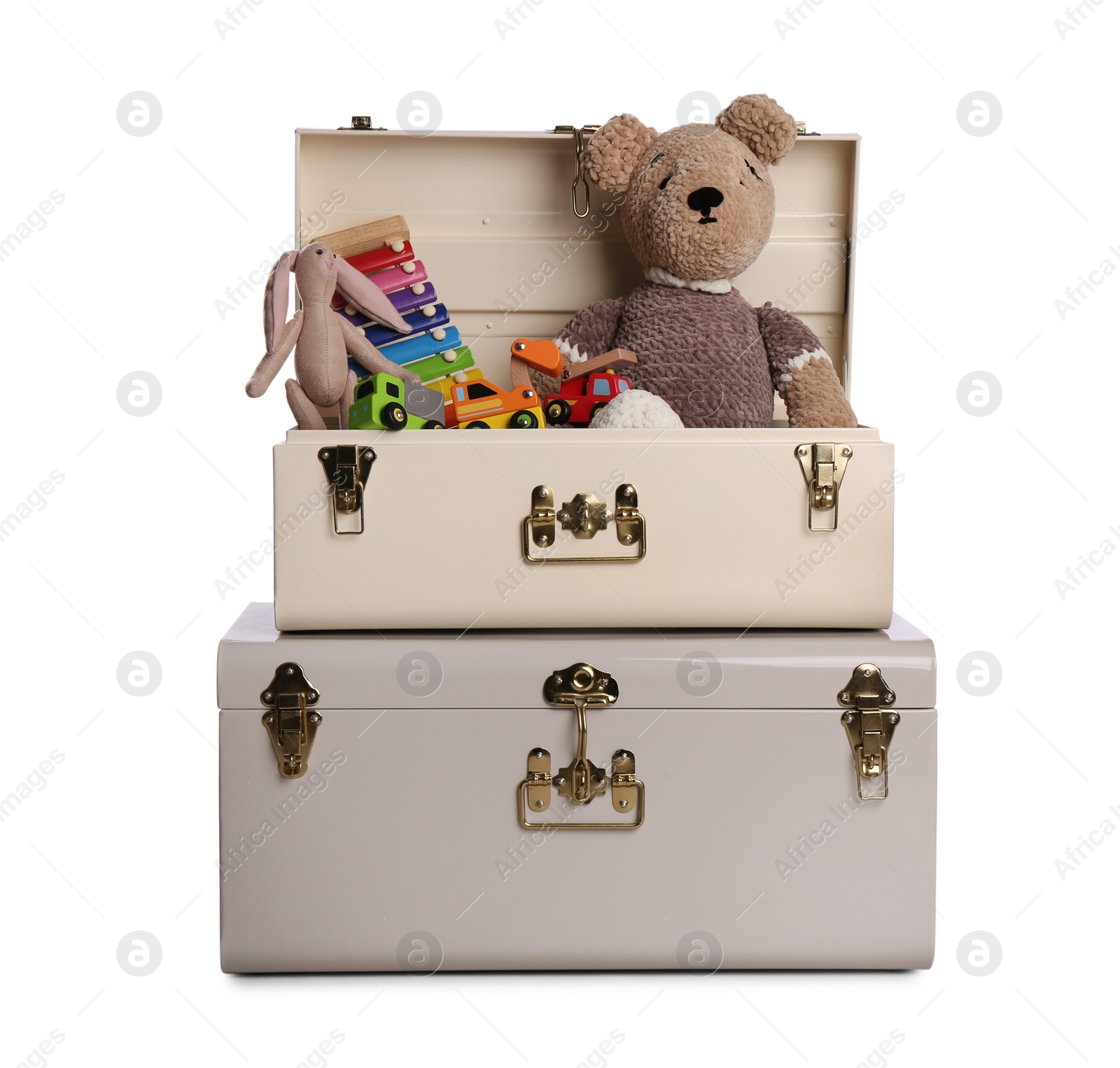 Photo of Stylish storage trunks with different toys isolated on white