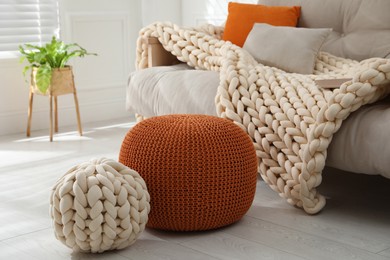 Stylish comfortable poufs in room. Home design