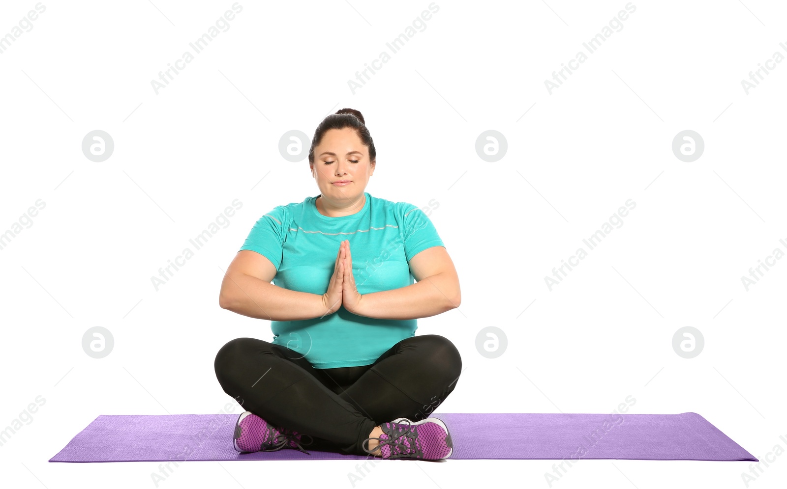 Photo of Overweight woman practicing yoga on white background