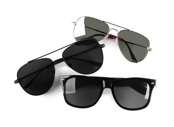 Different stylish sunglasses on white background. Sun protection