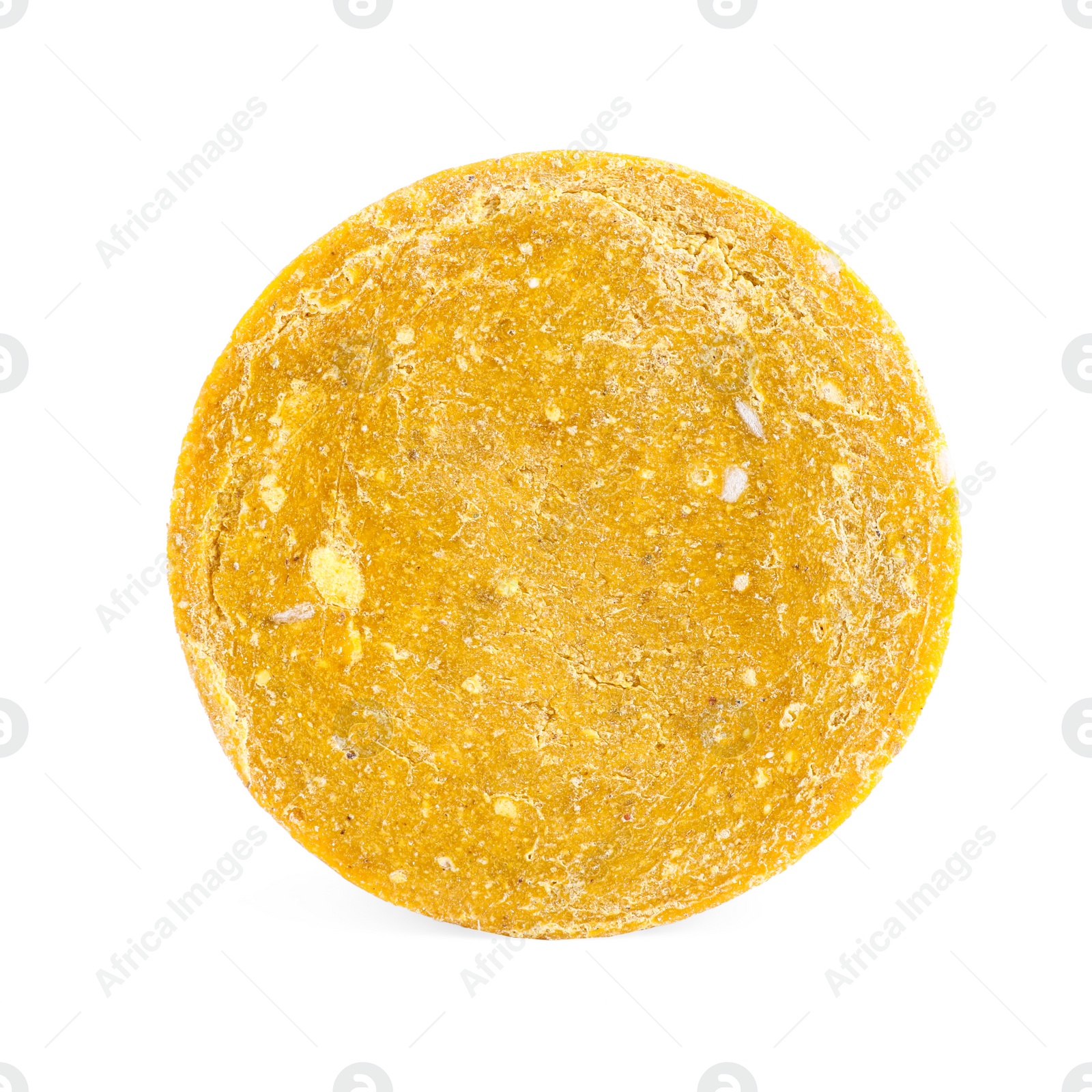 Photo of Yellow solid shampoo isolated on white. Hair care