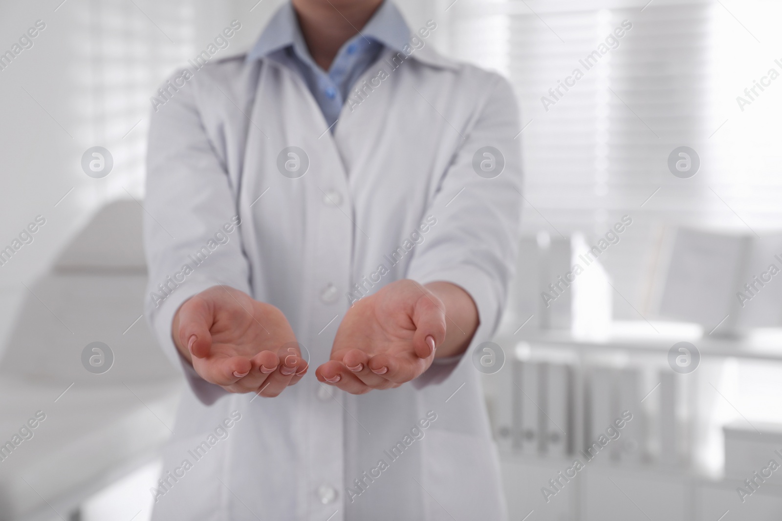 Photo of Dentist holding something in clinic, closeup view