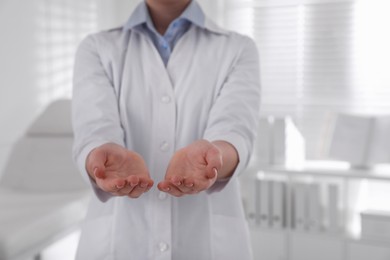 Dentist holding something in clinic, closeup view