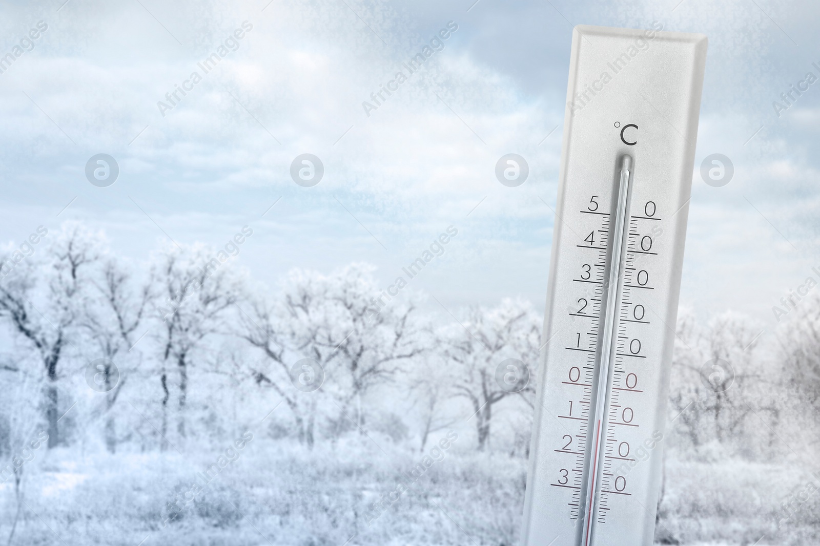 Image of Thermometer showing temperature below zero outdoors on winter day