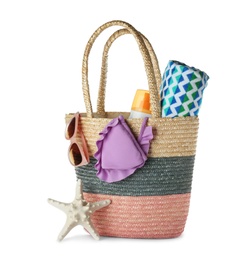 Composition with bag and beach accessories on white background