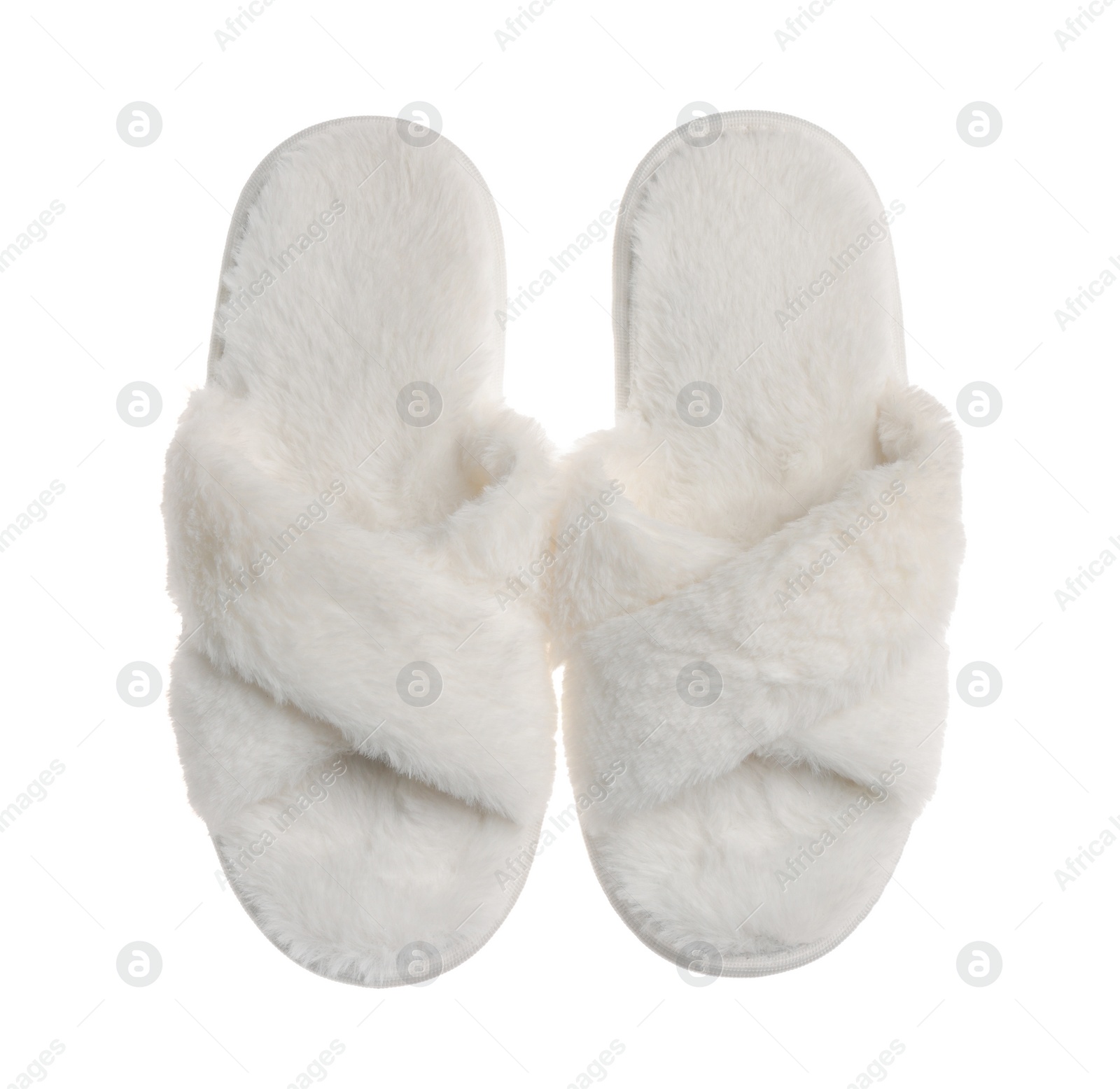 Photo of Pair of soft fluffy slippers on white background, top view