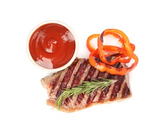 Photo of Delicious grilled beef steak with spices and tomato sauce isolated on white, top view