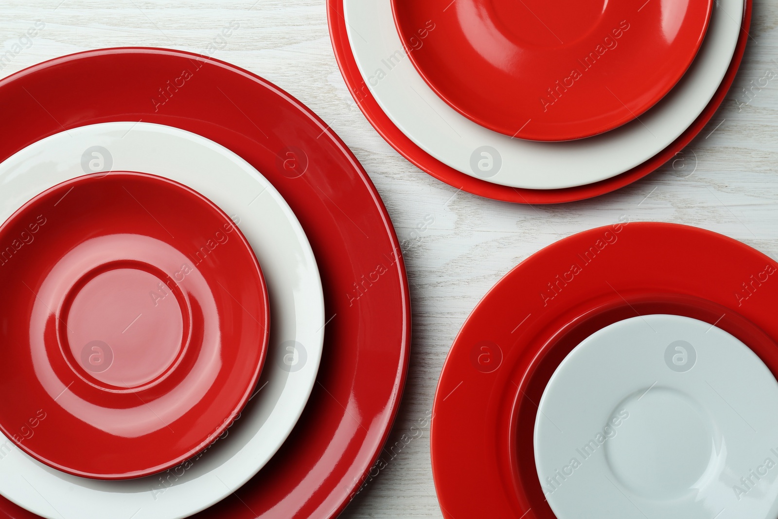 Photo of Flat lay composition with beautiful dishware on white wooden table