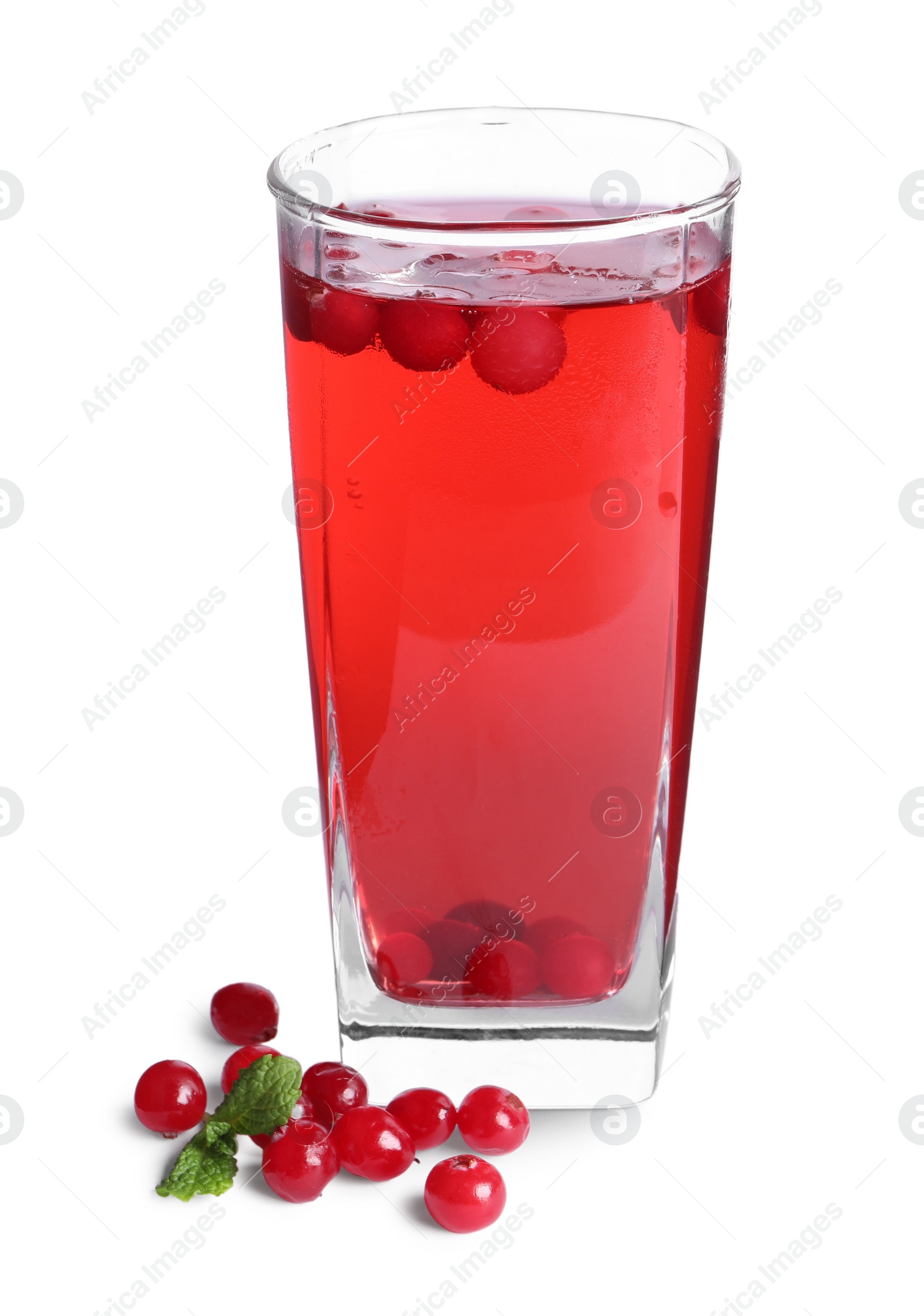 Photo of Tasty cranberry juice in glass and fresh berries isolated on white