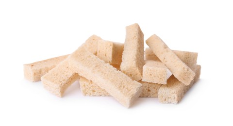 Photo of Heap of crispy rusks on white background