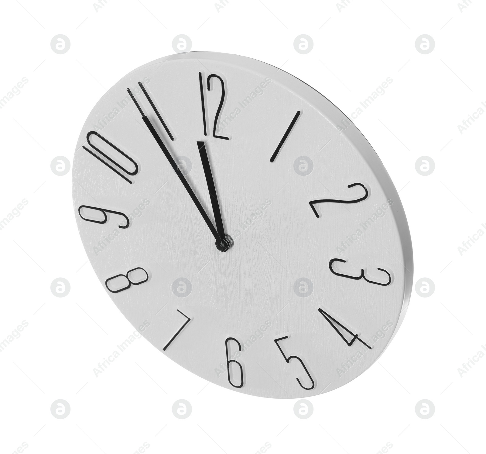 Photo of Clock showing five minutes until midnight on white background. New Year countdown