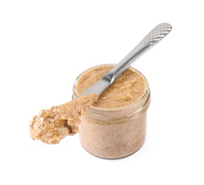 Delicious nut butter in jar and knife isolated on white