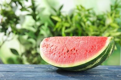 Fresh juicy watermelon with seeds on wooden table