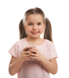 Photo of Cute little child with glass of tasty chocolate milk on white background