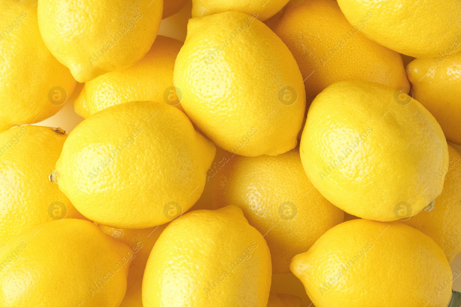 Photo of Many fresh ripe lemons as background