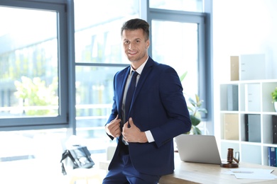 Photo of Portrait of male business trainer in office wear at workplace