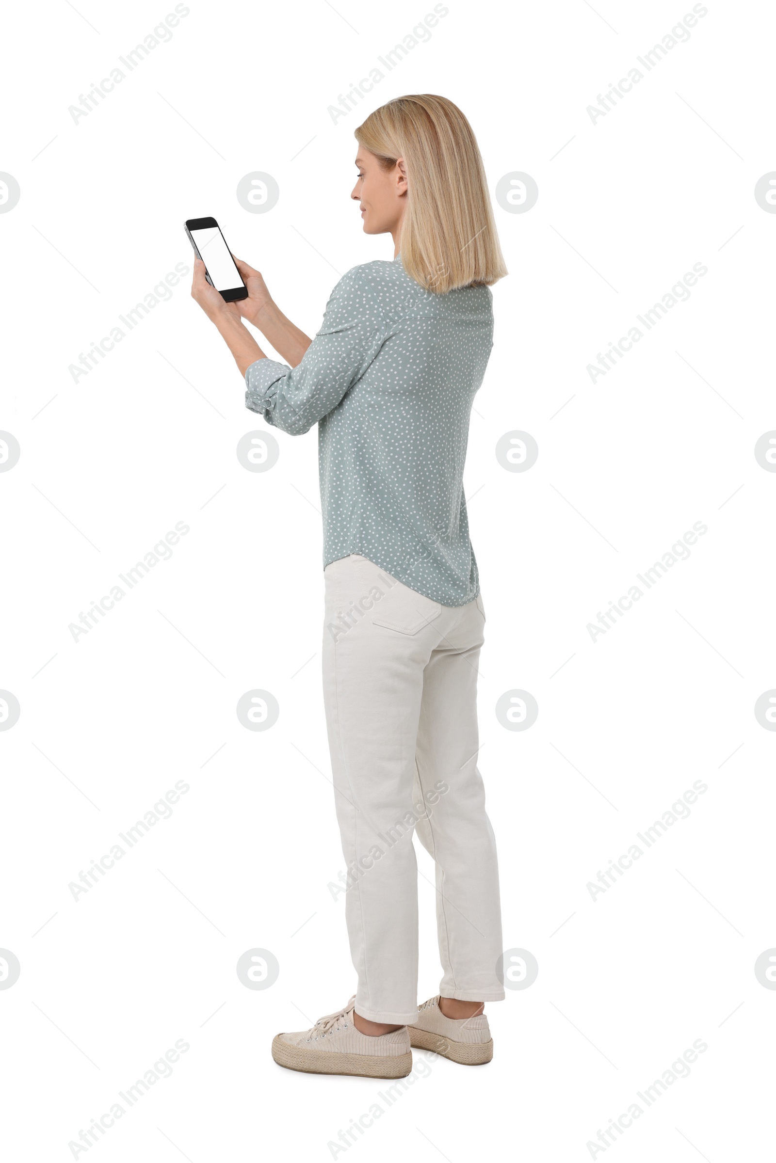Photo of Woman holding smartphone with blank screen on white background