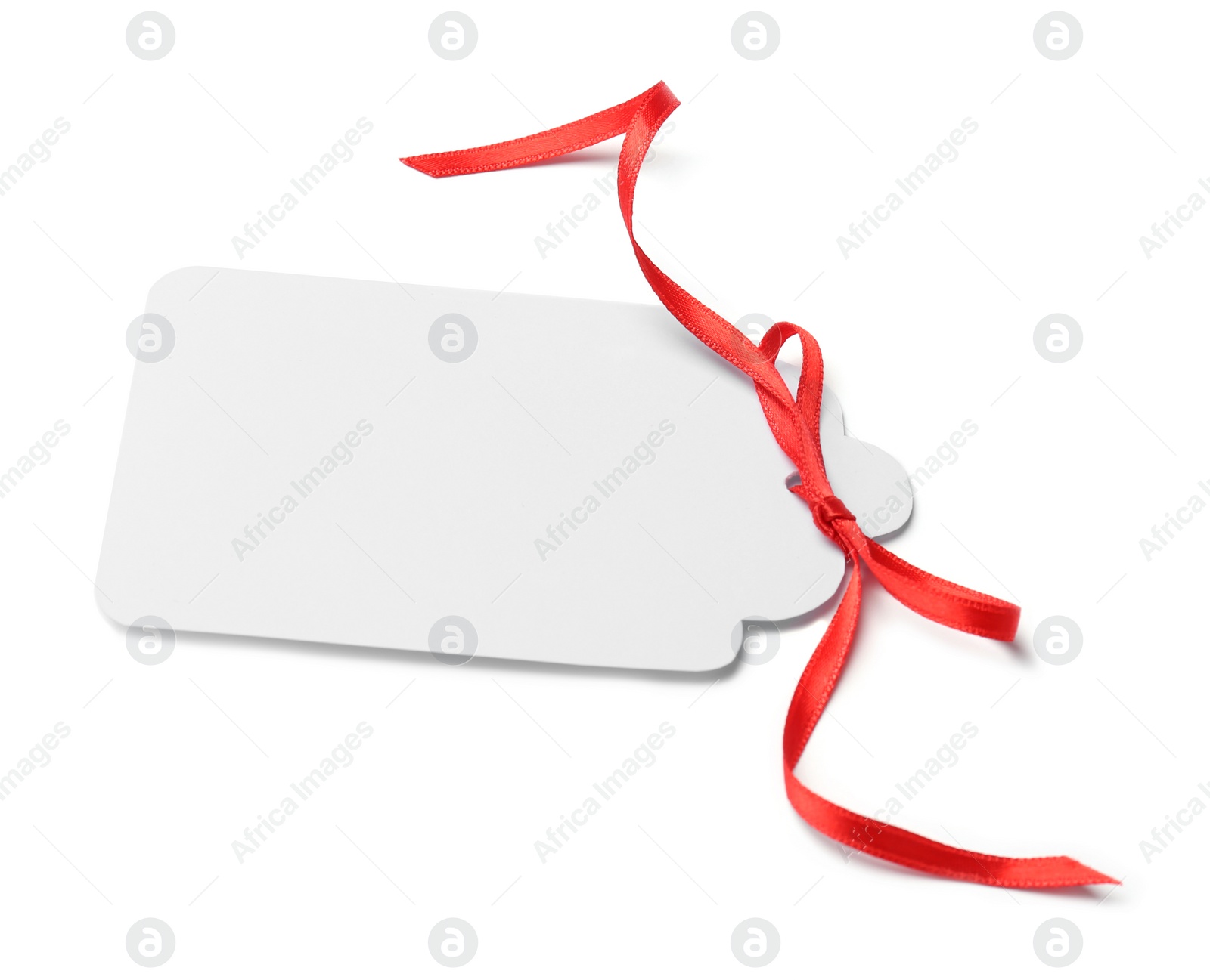 Photo of Blank gift tag with satin ribbon on white background