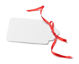 Photo of Blank gift tag with satin ribbon on white background