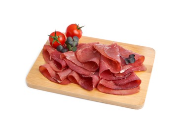 Photo of Slices of tasty bresaola and tomatoes isolated on white