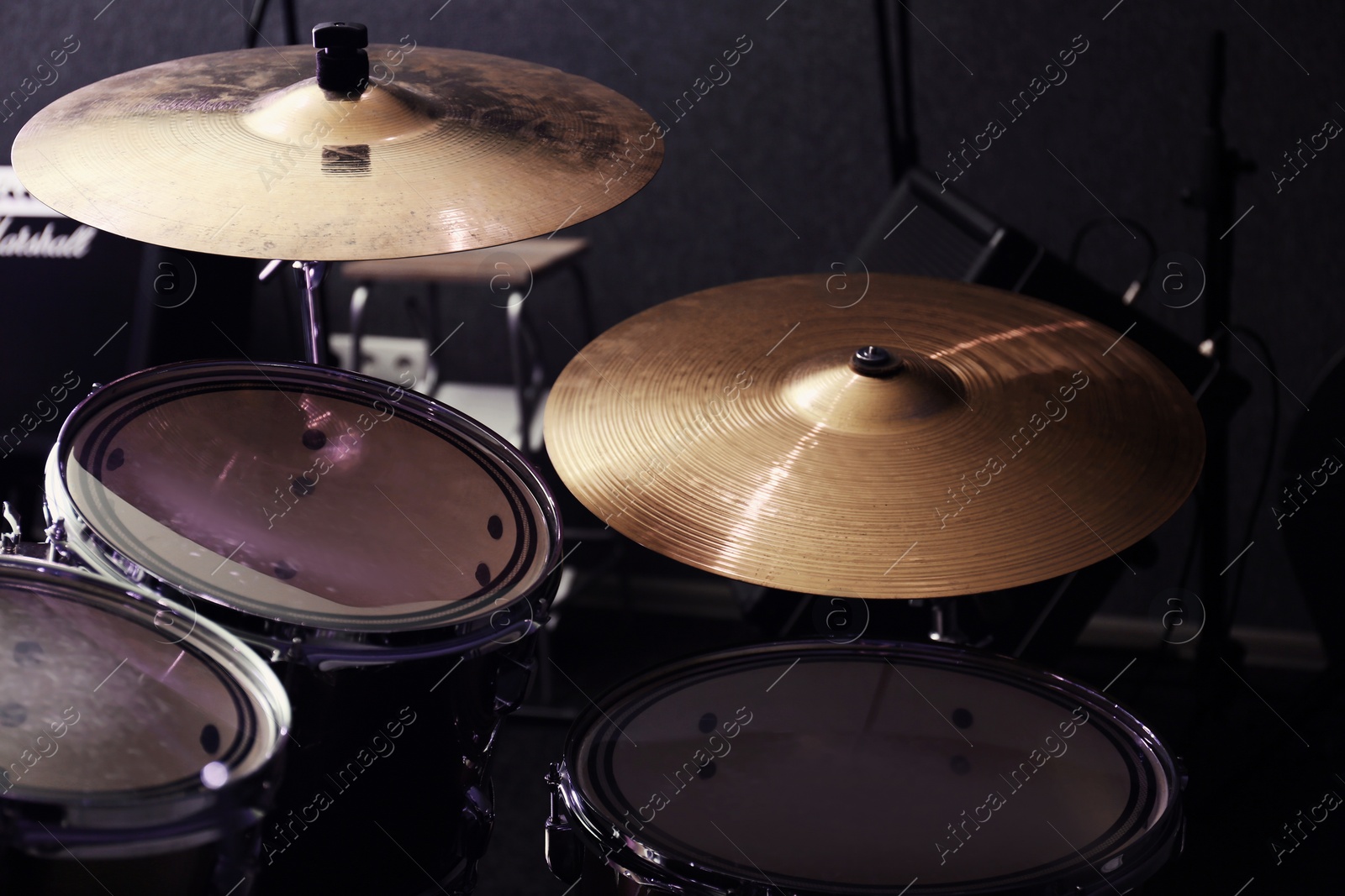 Photo of Modern drum set and cymbals in recording studio
