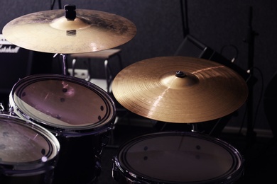 Photo of Modern drum set and cymbals in recording studio