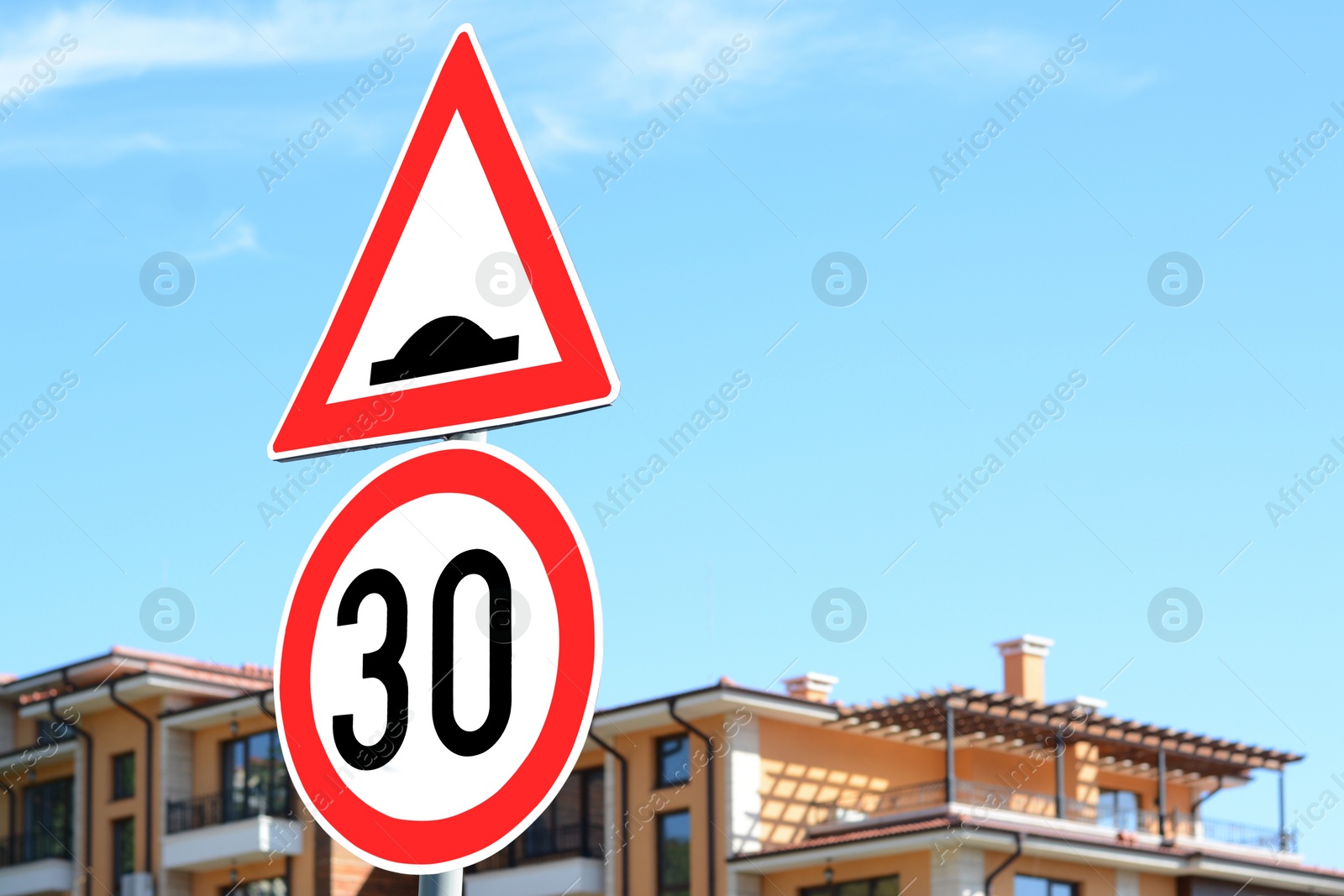 Photo of Post with different road signs outdoors on sunny day