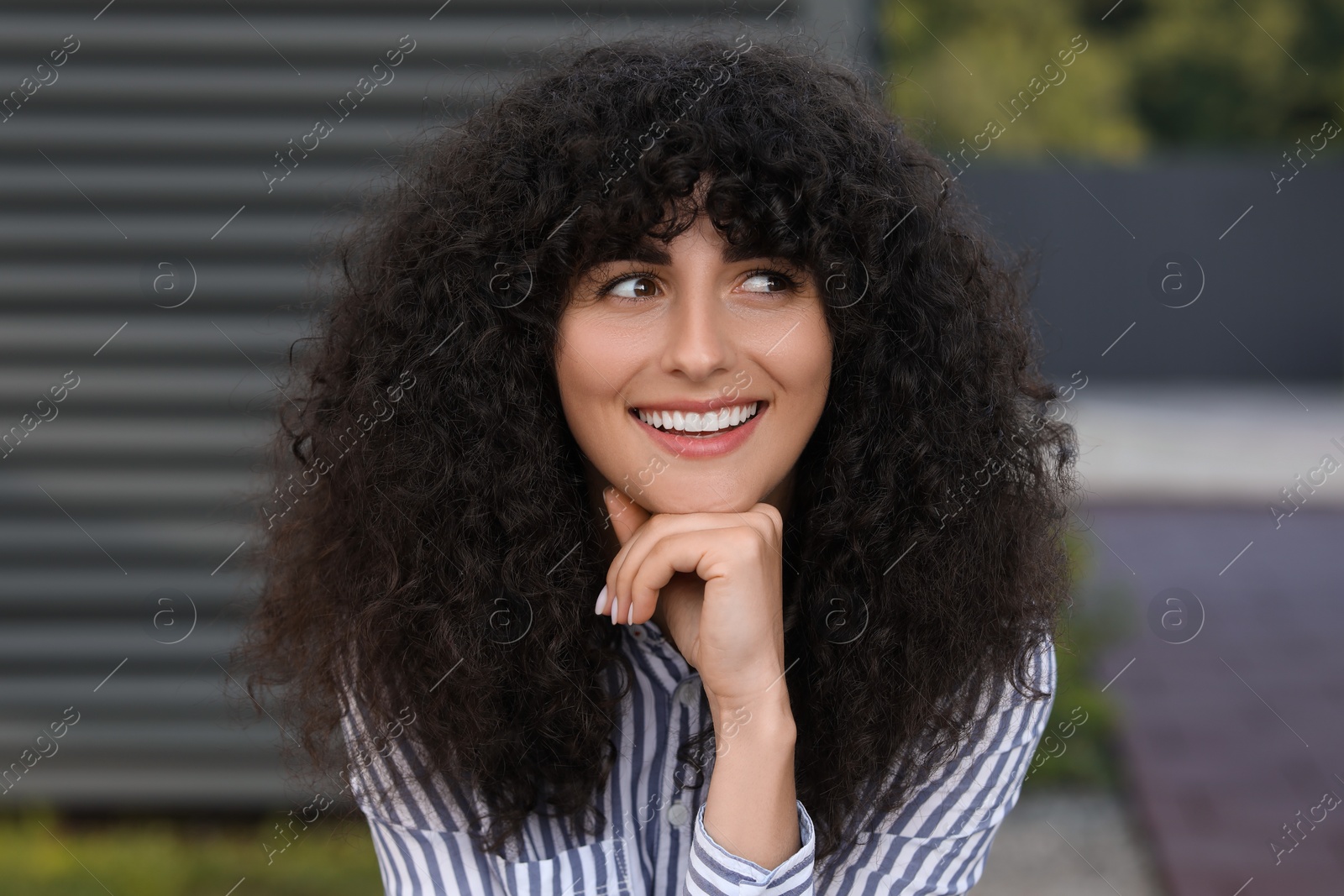 Photo of Portrait of beautiful woman outdoors. Attractive lady smiling and posing for camera