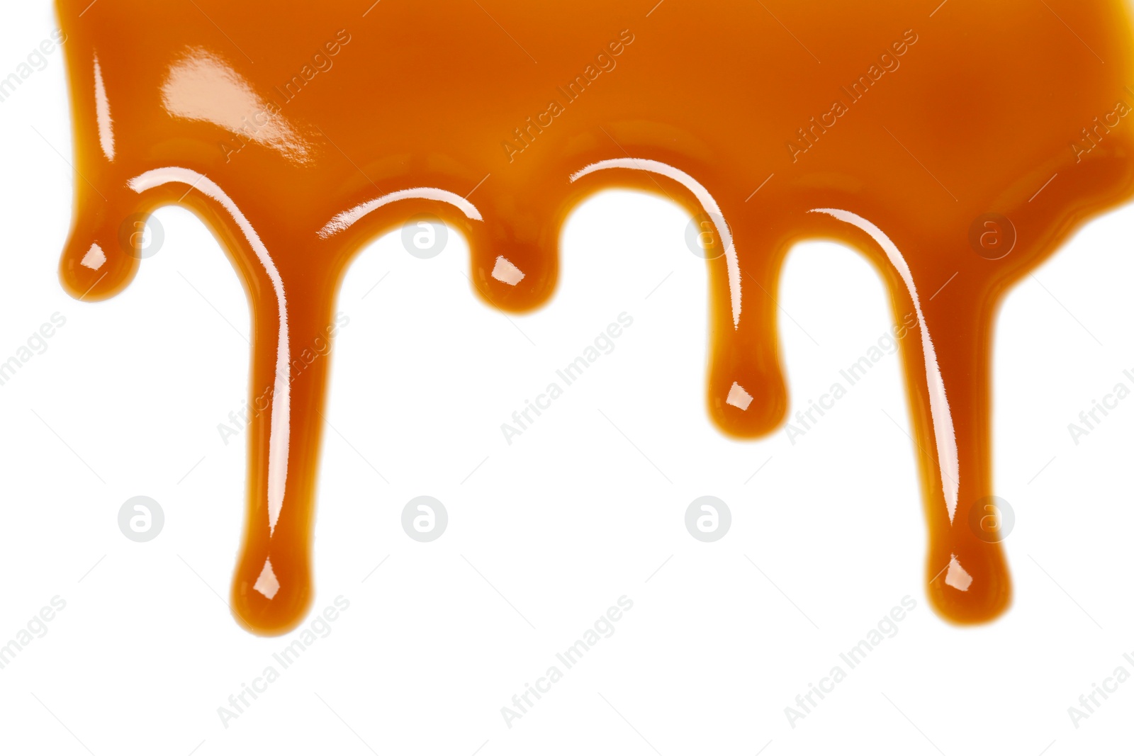 Photo of Delicious caramel sauce on white background