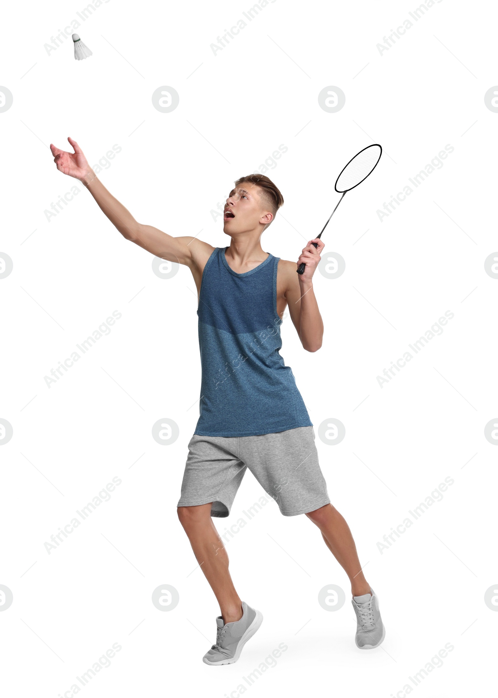 Photo of Young man playing badminton with racket and shuttlecock on white background