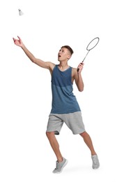 Photo of Young man playing badminton with racket and shuttlecock on white background