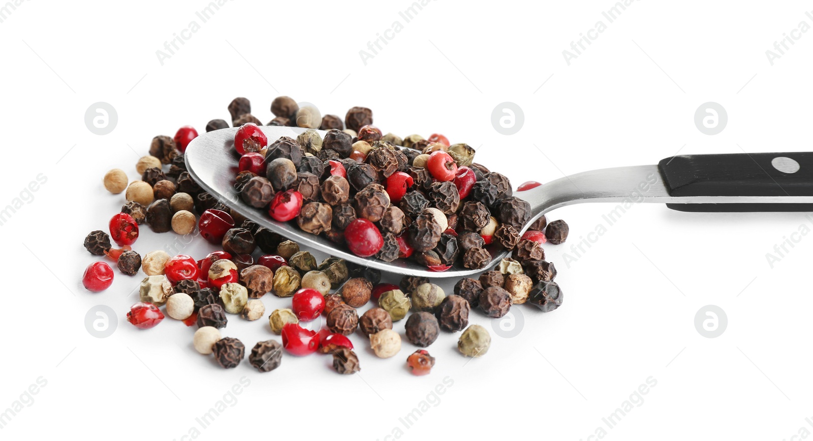 Photo of Spoon of mixed peppercorns isolated on white