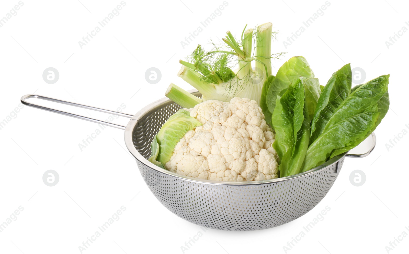 Photo of Metal colander with cauliflower, fennel and lettuce isolated on white