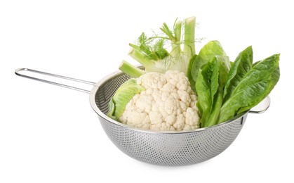 Photo of Metal colander with cauliflower, fennel and lettuce isolated on white