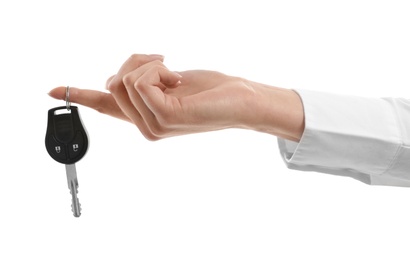 Photo of Woman holding car key isolated on white