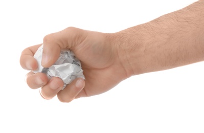 Photo of Man crumpling paper against white background, closeup. Generating idea