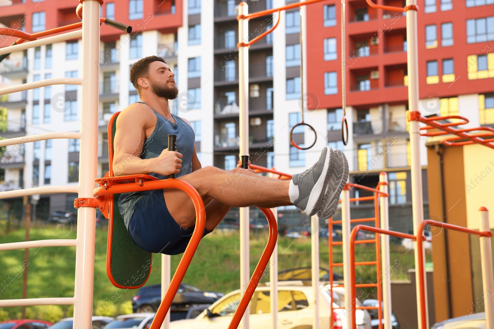 Photo of Man training on abs station at outdoor gym