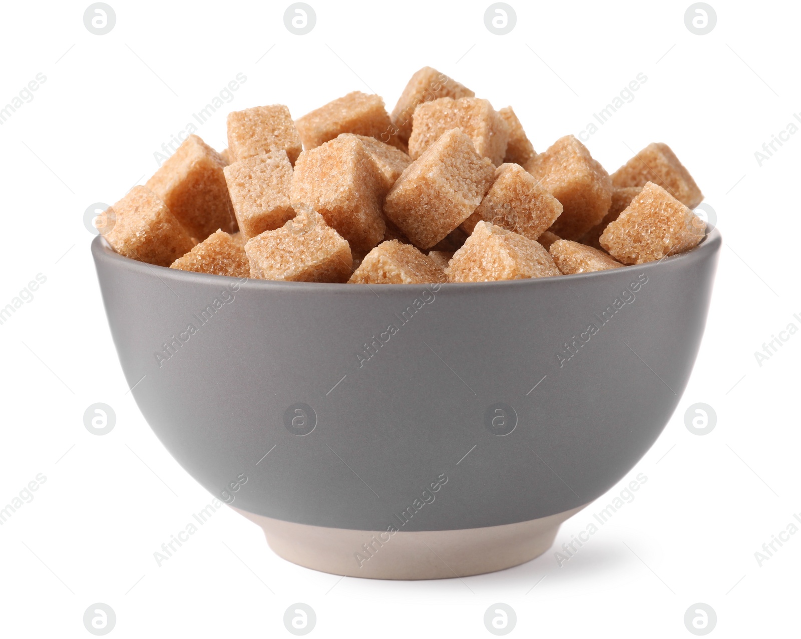 Photo of Bowl of brown sugar cubes isolated on white