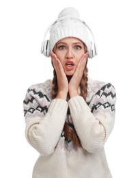 Young woman listening to music with headphones on white background