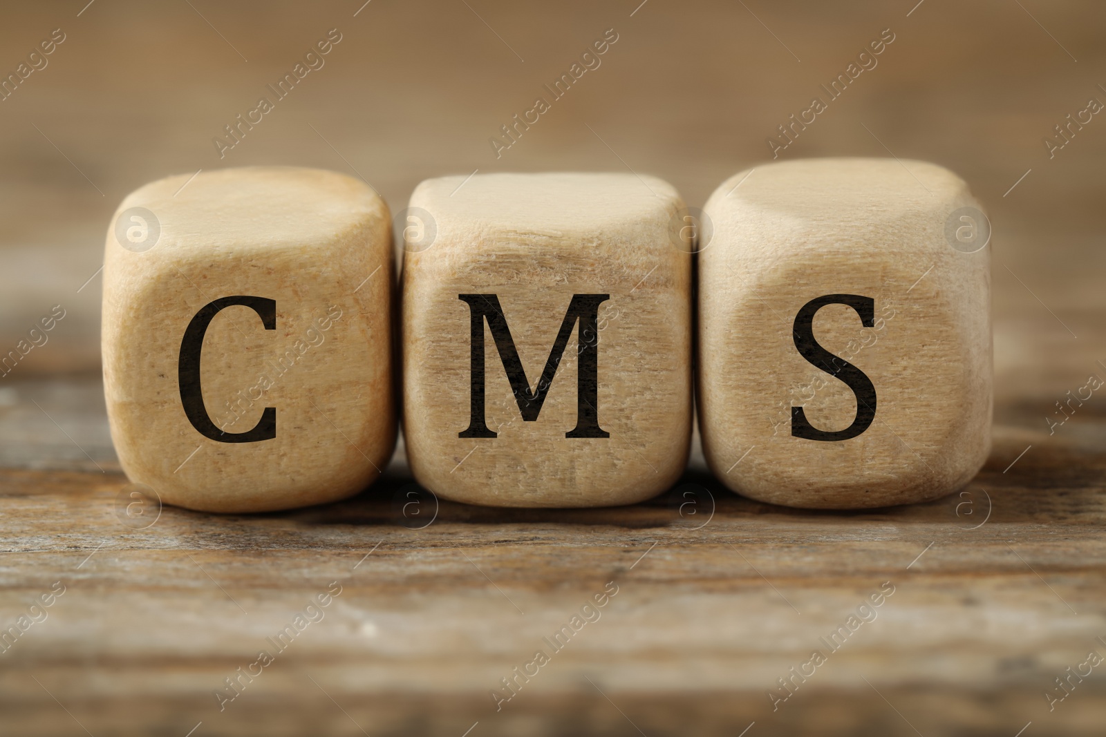 Photo of Abbreviation CSR (Corporate Social Responsibility) made of cubes on wooden table, closeup