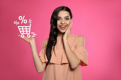 Image of Surprised woman and illustration of shopping cart with percent signs on pink background. Special promotion