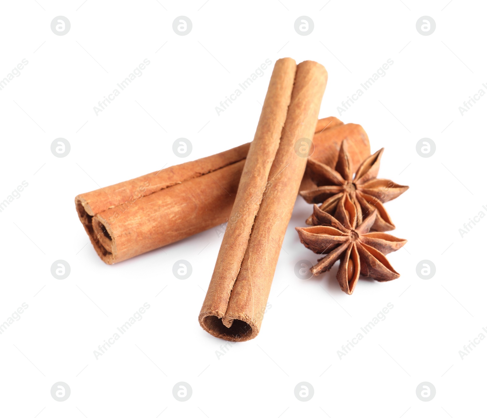 Photo of Cinnamon sticks and anise stars isolated on white