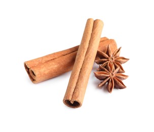 Photo of Cinnamon sticks and anise stars isolated on white