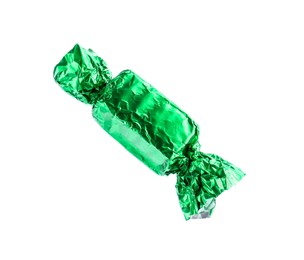 Tasty candy in green wrapper isolated on white