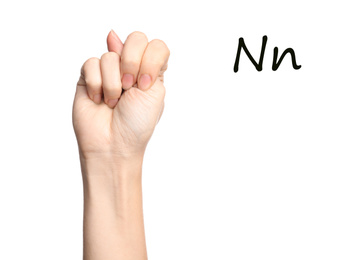 Woman showing letter N on white background, closeup. Sign language