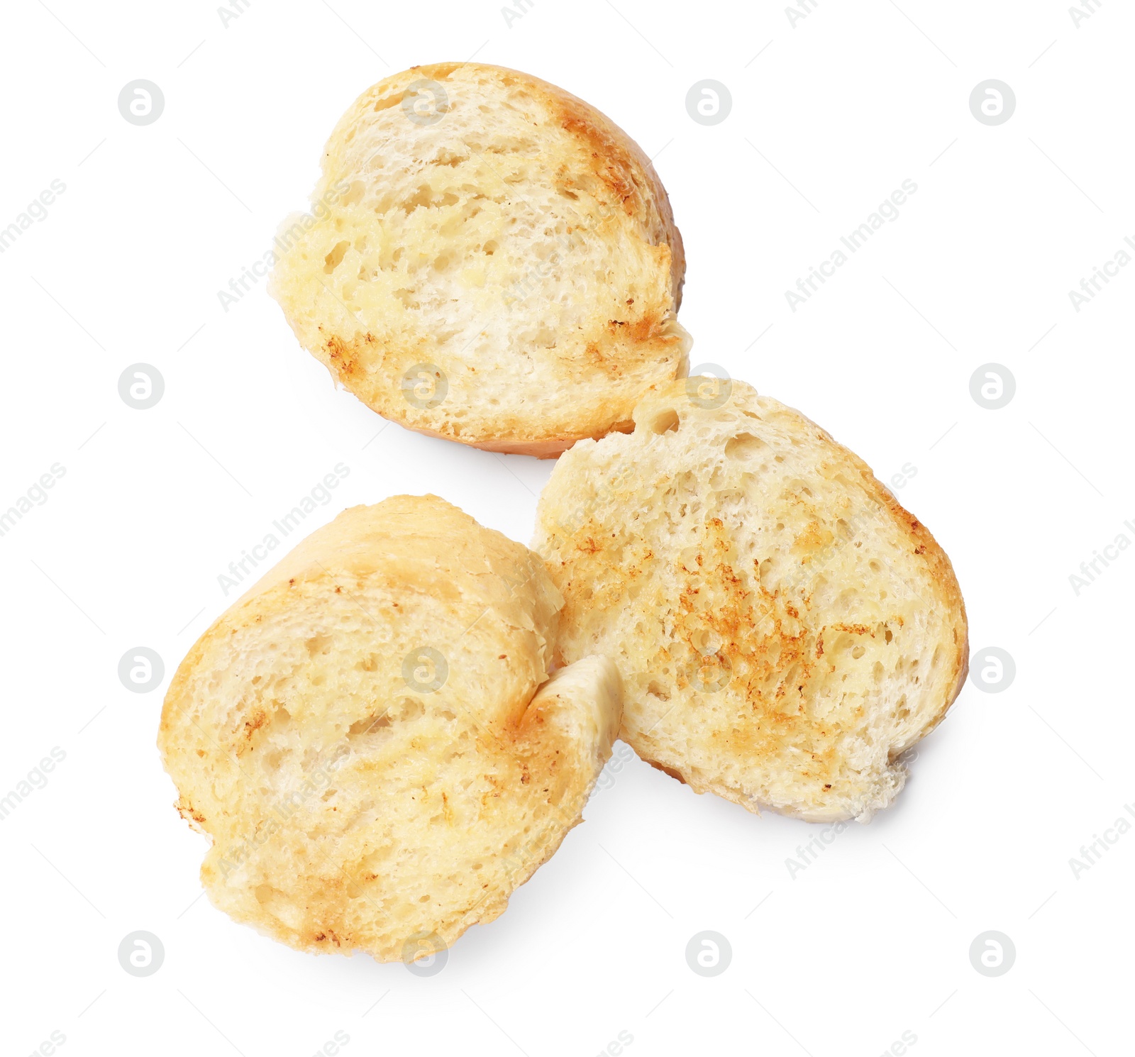 Photo of Pieces of toasted bread isolated on white, top view